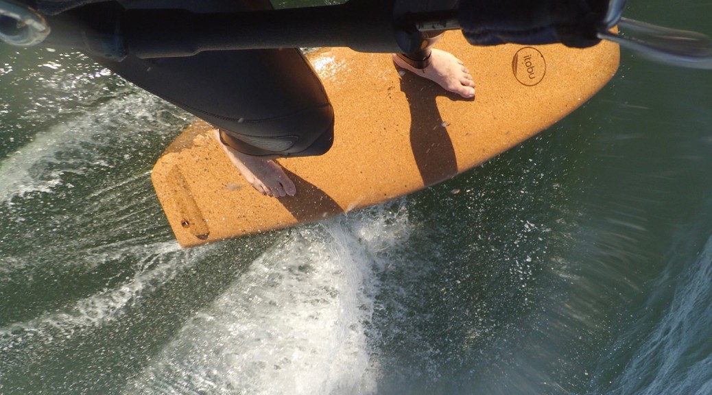 wooden surfboard with cork deck